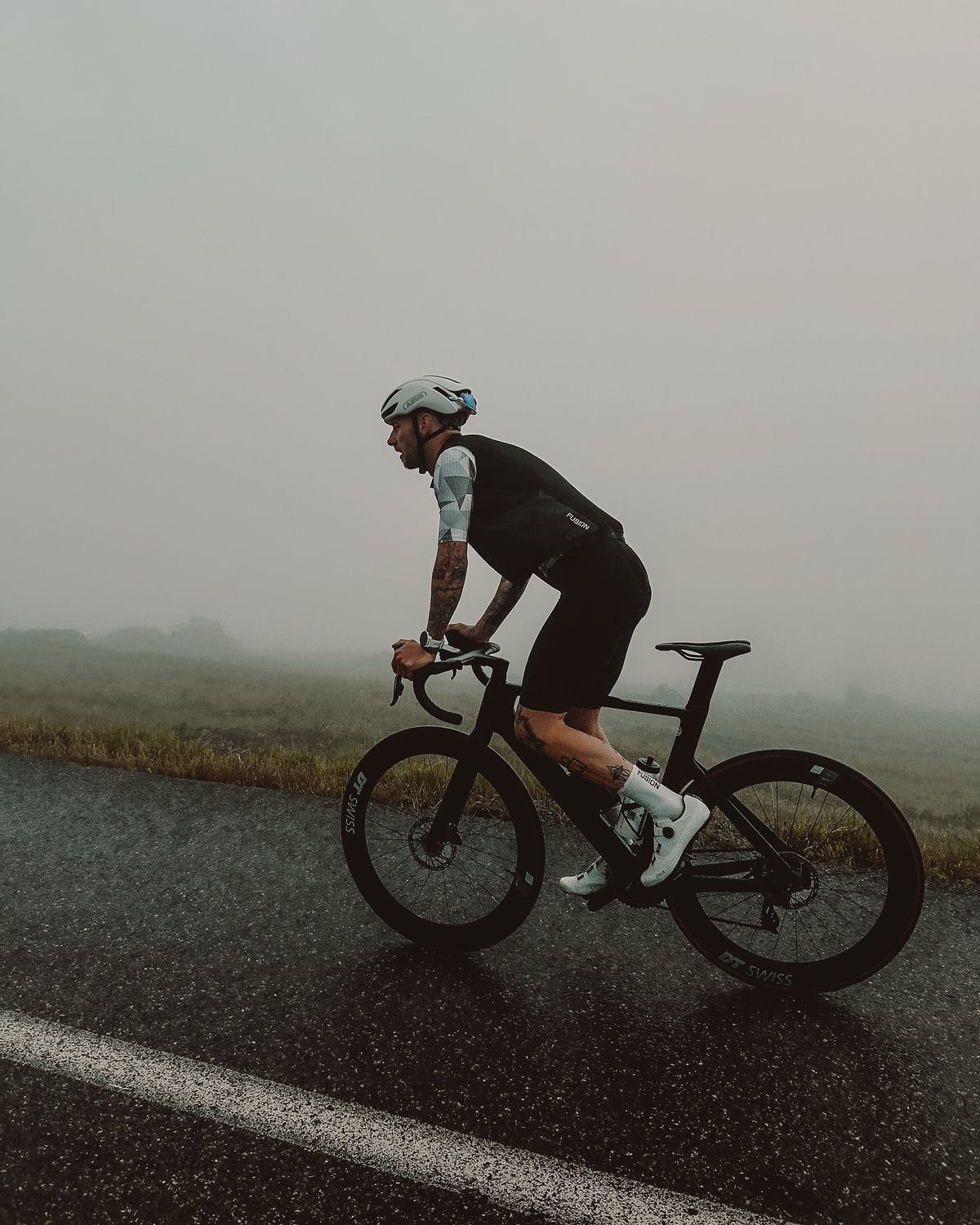 Cyclists riding through UK countryside